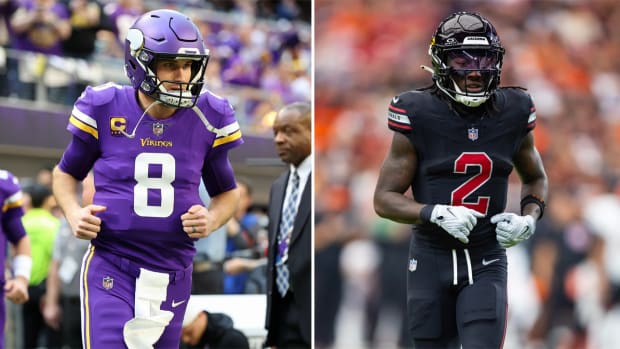Kirk Cousins runs onto the field;
                                                                                 Marquise Brown jogs